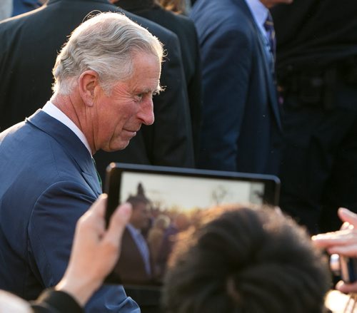 Prince Charles waves to the crowd at the Legislature Wednesday evening. More than 1000 people cheered for Prince Charles and Camilla, Duchess of Cornwall, as they made their final stop at the Legislature on a whirlwind 27-hour royal tour visit to Winnipeg. 140521 - Wednesday, May 21, 2014 - (Melissa Tait / Winnipeg Free Press)