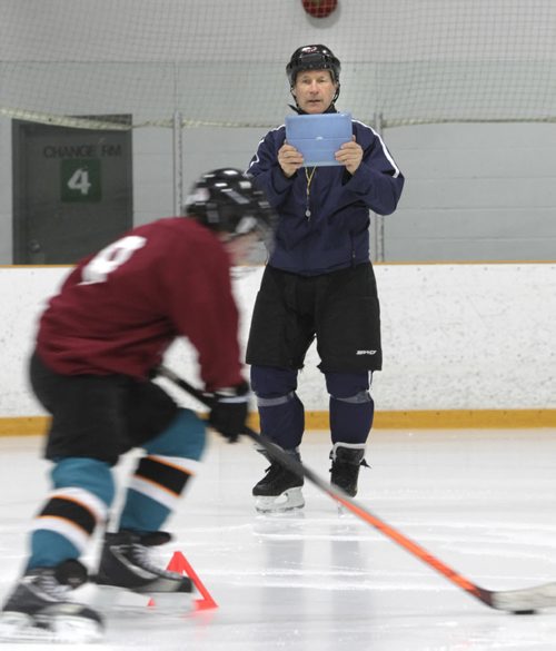 Morris Lukowich, who played for the WHA and NHL Jets, has a company called "Max Goal Scoring" that he takes on the road to teach kids the art of scoring. Geoff Kirbyson story.  Morris records young hockey player going through skating drill. Wayne Glowacki / Winnipeg Free Press May 22 2014