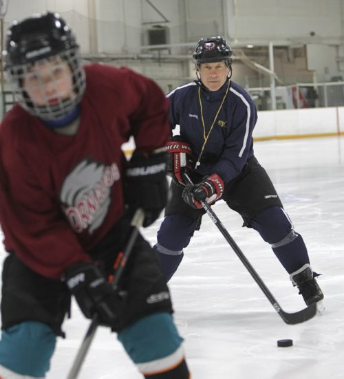 Morris Lukowich, who played for the WHA and NHL Jets, has a company called "Max Goal Scoring" that he takes on the road to teach kids the art of scoring. Geoff Kirbyson story.  Morris goes through drills with a young hockey player. Wayne Glowacki / Winnipeg Free Press May 22 2014