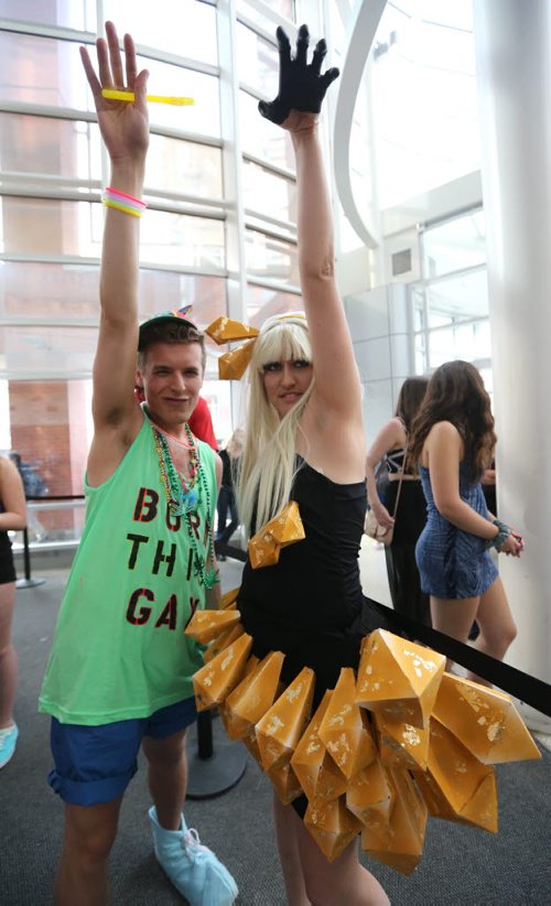Michaela Rebus (right), of Edmonton, and Winnipegger Matthew Giesbrecht have some fun while waiting for the doors to open at the MTS Centre for the Lady Gaga concert on Thurs., May 22, 2014. Photo by Jason Halstead/Winnipeg Free Press