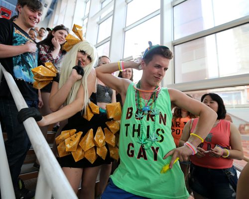 Michaela Rebus (left), of Edmonton, and Winnipegger Matthew Giesbrecht have some fun while waiting for the doors to open at the MTS Centre for the Lady Gaga concert on Thurs., May 22, 2014. Photo by Jason Halstead/Winnipeg Free Press