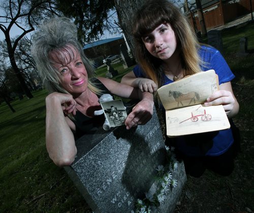 Sandi Lazaruk and her daughter Salina surviving family of a nine year old girl who left a diary when she died on 1909 pose beside the girl's grave. See Gord Sinclair's story. May 22, 2014 - (Phil Hossack / Winnipeg Free Press)