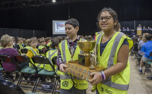 140523 Winnipeg - DAVID LIPNOWSKI / WINNIPEG FREE PRESS (May 23, 2014)  Grade 5 Ecole River Bend Community School safety patrols Daija Torres (age 10), and Dexter Furber (age 11) carry their divisional award Friday morning at the Convention Centre. The Winnipeg Police Service acknowledged the services of school safety patrols at the annual awards ceremony.