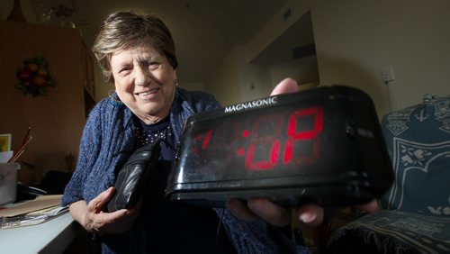 Viola Dufresne shows off her "Granny Cam" hidden in a digital clock. The 82 year old used the device to catch care worker red handed on video. See Mike MacIntyre's story. May 23, 2014 - (Phil Hossack / Winnipeg Free Press)