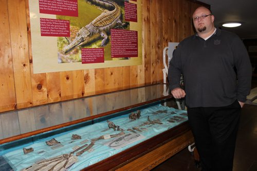 014- Adam Hanson, manager of the Fort Dauphin Museum, and the display of fossilized crocodile bones found near Dauphin. BILL REDEKOP/WINNIPEG FREE PRESS April 11,2014