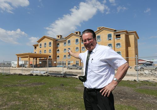 Selkirk mayor Larry Johannson stands in front of the under-construction Canalta Hotel on Manitoba Avenue in Selkirk on Fri., May 23, 2014. ItÄôs the first hotel being built in the city for almost half a century. Photo by Jason Halstead/Winnipeg Free Press