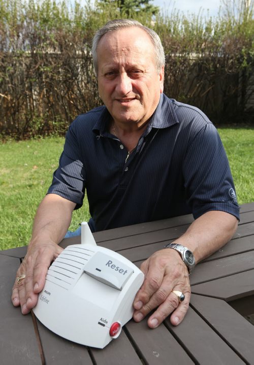 Gerry Desrosiers, a retired banker, volunteers with Victoria Lifeline, installing personal help buttons in people's homes so they can get emergency assistance if they require it. Desrosiers was photographed at his home on Fri., May 23, 2014. RE: Volunteers column for May 26 Photo by Jason Halstead/Winnipeg Free Press