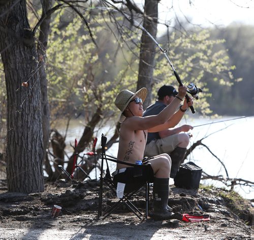 John Haw (front) and Mike Barnsdale do some evening fishing in St. Vital Park on Fri., May 23, 2014. Photo by Jason Halstead/Winnipeg Free Press