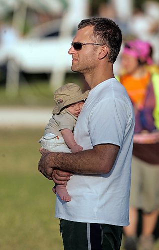 BORIS MINKEVICH / WINNIPEG FREE PRESS 070708 Jay Toews with his 3 month old son Roen enjoy their first folk festival.