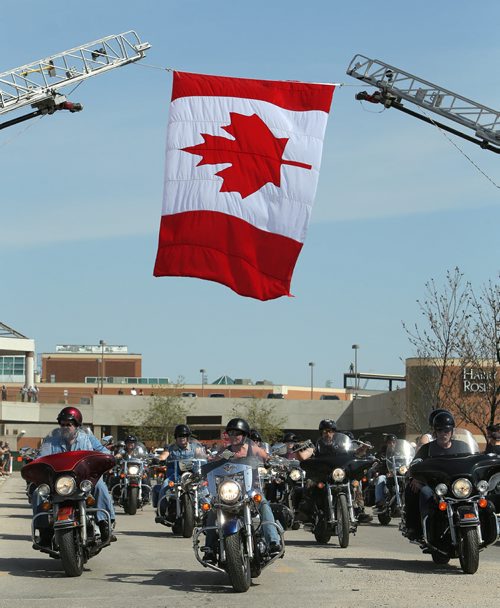 Motorcyclists leave Polo Park to take part in the annual Ride For Dad on Sat., May 24, 2014. Thousands took part in the ride from Winnipeg to Selkirk that also involved lunch and poker run while helping to raise money to fight prostate cancer. Photo by Jason Halstead/Winnipeg Free Press