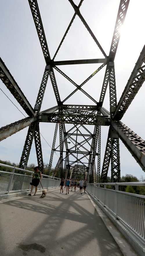People stroll across Elm Park Bridge (the span connecting Bridge Drive-In with Kingston Row). The 100th anniversary of the bridge was celebrated on Sat., May 24, 2014.  Photo by Jason Halstead/Winnipeg Free Press