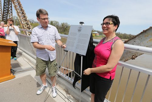 City councillors Brian Mayes and Jenny Gerbasi unveil a plaque to commemorate he 100th anniversary of Elm Park Bridge (the span connecting Bridge Drive-In with Kingston Row) on Sat., May 24, 2014.  Photo by Jason Halstead/Winnipeg Free Press