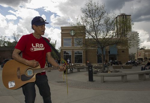 140524 Winnipeg - DAVID LIPNOWSKI / WINNIPEG FREE PRESS (May 24, 2014)  Eric Pyle, who is better known as Eric The Great busks at Osborne Village Square Saturday afternoon.  For Our Wpg story