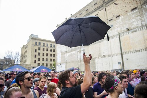 140524 Winnipeg - DAVID LIPNOWSKI / WINNIPEG FREE PRESS (May 24, 2014)  The audience enjoys Winnipeg Band, Imaginary Cities performs in the rain during an outdoor concert performance as part of the Red Bull Tour Bus Hometown Tour, Saturday afternoon on Market Ave. Royal Canoe was also scheduled to perform.