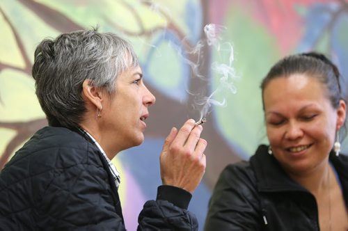 Medical marijuana patients Lee-Anne Kent (right) and Holly Plouffe smoke at the Medical Marijuana Lounge and Resource Centre at Vapes on Main on Mon., May 26, 2014. Former police officer Bill VanderGraaf and two partners have opened up a lounge for medical marijuana users at 1402 Main St. RE: Larry Kusch story Photo by Jason Halstead/Winnipeg Free Press