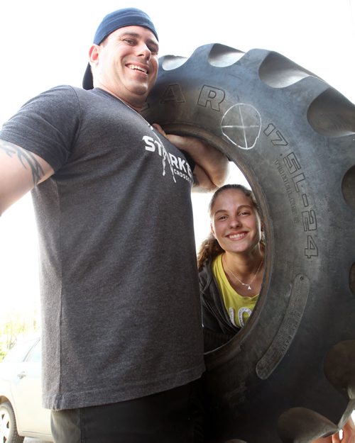 Jesse Cox, an instructor/trainer at Starke CrossFit with his daughter Angelica Cox, 13 lifting a tractor tire  .He will be competing in the 2014 PEAK Death Race on June 27-30 at Pittsfield, Vermont. It is an endurance race during which competitors must complete difficult, challenging, absurd or bizarre tasks over a 24-70 hour period. Competitors arrive on the given day but don't know in advance when the race will start, when it will end, what it will entail. It usually has just a 10 percent completion rate. See Ashley Prest story- May 27, 2014   (JOE BRYKSA / WINNIPEG FREE PRESS)