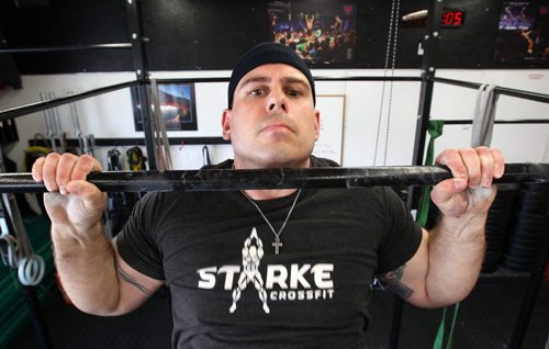 Jesse Cox, an instructor/trainer at Starke CrossFit does chin-ups  .He will be competing in the 2014 PEAK Death Race on June 27-30 at Pittsfield, Vermont. It is an endurance race during which competitors must complete difficult, challenging, absurd or bizarre tasks over a 24-70 hour period. Competitors arrive on the given day but don't know in advance when the race will start, when it will end, what it will entail. It usually has just a 10 percent completion rate. See Ashley Prest story- May 27, 2014   (JOE BRYKSA / WINNIPEG FREE PRESS)