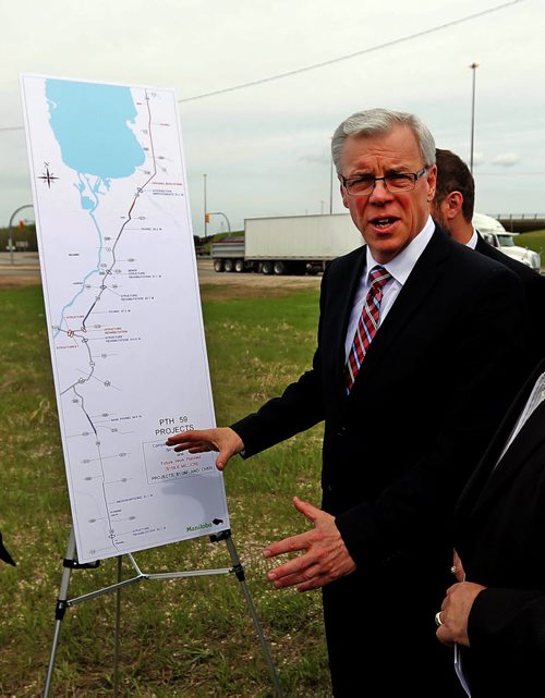Premier Greg Selinger  announce $160 million on major repaving and bridge rehabilitation  along the Perimeter Hwy 101 and Hwy 59 as well as a pedestrian overpass  May 27  2014 / KEN GIGLIOTTI / WINNIPEG FREE PRESS