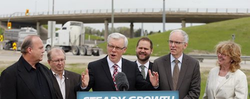 Premier Greg Selinger and  Transportation Minister Steve Ashton announce $160 million on major repaving and bridge rehabilitation  along the Perimeter Hwy 101 and Hwy 59 as well as a pedestrian overpass  May 27  2014 / KEN GIGLIOTTI / WINNIPEG FREE PRESS