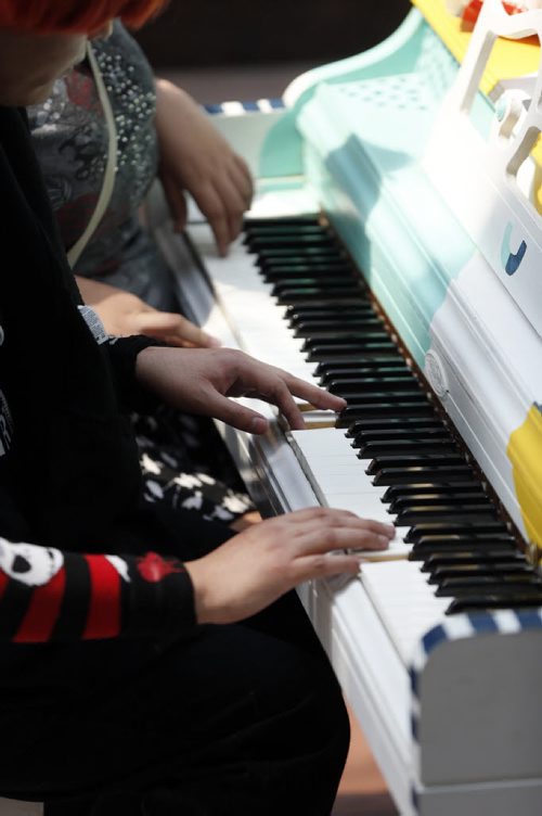 Playing hands of left Jason Beardy  and cousin Monica Beardy plays piano at Portage Place left during Juno Week  .Downtown pianos update , Piano at Portage Place . story by Jessica Botelbo-Urbanski  May 27 2014 / KEN GIGLIOTTI / WINNIPEG FREE PRESS