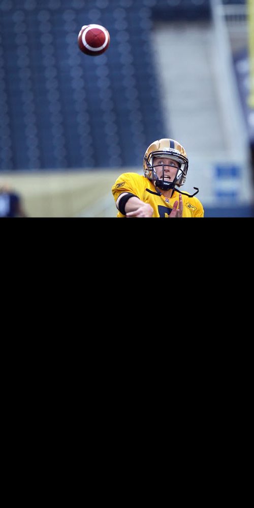 Quarterback Drew Willy at practice Wednesday evening. See Ed Tait's tale. May 28, 2014 - (Phil Hossack / Winnipeg Free Press)