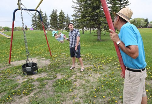 Crestview residents are upset with Coun. Grant Nordmans plans to convert Voyageur Park into an off-leash dog park. Dan Legg with his daughter Audrey  chat with neighbor John Bazarkewich, right , about new plans for park Thursday.Aldo Santin story- May 21, 2014   (JOE BRYKSA / WINNIPEG FREE PRESS)