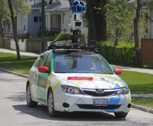 STANDUP - North end photo session. The Google Maps car drives up and down the streets in the north end on a hot Thursday afternoon. The car was seen near Arlington and Stella. BORIS MINKEVICH / WINNIPEG FREE PRESS  May 29, 2014