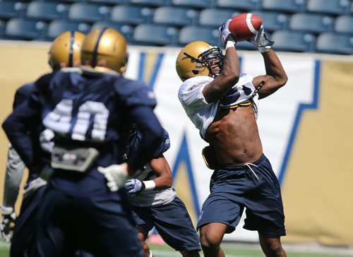 Winnipeg Blue Bombers RB Kevin Smith makes a catch during football practice at Investors Group Field on Thurs., May 29, 2014. Photo by Jason Halstead/Winnipeg Free Press