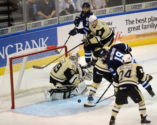 5/29/2014 - A scramble in front of the Penguins' net, Thursday, during the playoff game against the St. John's IceCaps. Photo Andrew Krech  cv30PensCapsp1