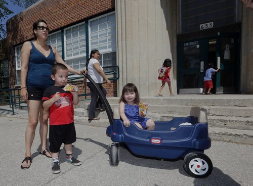left Cheyenne Tizya  with her kids Ethan age 3 and Jaylynn age 2 outside  Inkster School .Inkster School parents favour reduction of speed but would like to see Inkster Blvd reduced also . REDUCED SPEED ZONES Äî A report that proposes a new bylaw to establish reduced-speed school zones in Winnipeg will be considered Tuesday by the Committee on Infrastructure Renewal and Public Works. If approved by the city, maximum speed limits of 30 km/h would be set up around 171 Winnipeg schools, in effect from 7 a.m. to 5:30 p.m., Monday to Friday during the months of September to June. Story Santin Rollason  May 30 2014 / KEN GIGLIOTTI / WINNIPEG FREE PRESS