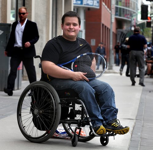 Sam Unrau poses on Portage Ave Friday, he's an advocate for wheelchair sport and a tennis player himself. See Melissa Martin's story.  May 30, 2014 - (Phil Hossack / Winnipeg Free Press)
