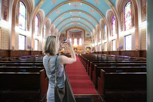 Maria Froese takes a picture of the interior of the Ukrinian Catholic Metropolitan Cathedral of Vladimir and Olga, at 115 McGregor St. during   the annual Open Doors Winnipeg event. Saturday. See story.   May 31, 2014 Ruth Bonneville / Winnipeg Free Press