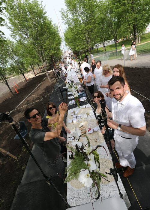 Clockwise from left, Jason Hotte, Lauren Henry, Maxine Plessis, Melissa Rabb and Emil-Peter Sosnowski prepare for Table for 1200, on the Esplanade Riel Bridge on Sat., May 31, 2014. The event is an initiative of StorefrontMB and 5468796 Architecture, and was created to highlight Winnipeg's emerging design scene by bringing together architecture, design and the culinary arts. The prairie-themed food for the Äòpop upÄô outdoor dining experience will be provided by local chefs Mandel Hitzer from Deer + Almond and Joe Kalturnyk from RAW Gallery, along with Ben Kramer from Diversity Food Services. Photo by Jason Halstead/Winnipeg Free Press