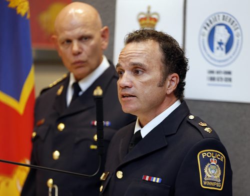 RCMP and Wpg Police Service announce  arrest in Project Devote , arrested is Traigo Ehkid  age 38 for the alledged  murder of Myrna Letandre .In photo RtoL , WPS Superintendent  Danny Smyth  and RCMP Chief superintendent Scott Kolody make the announcement  June 2  2014 / KEN GIGLIOTTI / WINNIPEG FREE PRESS