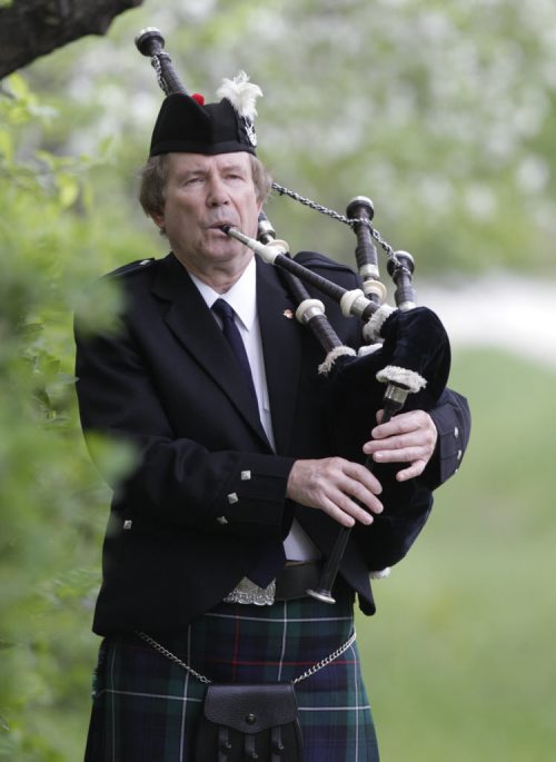 49.8 INTERSECTION.  Bagpiper Robyn McCombe with his Highland Bagpipes. This is for an Intersection piece on bagpipers who play at weddings. Dave Sanderson story Wayne Glowacki / Winnipeg Free Press June 2 2014