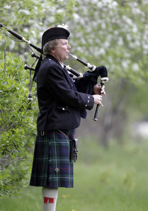 49.8 INTERSECTION.  Bagpiper Robyn McCombe with his Highland Bagpipes. This is for an Intersection piece on bagpipers who play at weddings. Dave Sanderson story Wayne Glowacki / Winnipeg Free Press June 2 2014