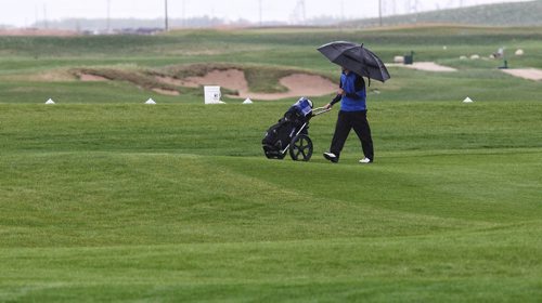 Players try to get in a few extra holes as the rain drenches the course during the practice round for the University Golf Championship being held at Southwood this year.  140602 June 02, 2014 Mike Deal / Winnipeg Free Press