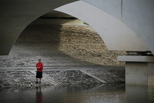 June 2, 2014 - 140602  -  Jordan Jeffs was fishing with his friend Brett Robertson on the La Salle River under the St. Norbert Bridge Monday, June 2, 2014. The friends say the fishing is good for walleye and pike. They say they caught a 26 inch pike on Saturday. John Woods / Winnipeg Free Press