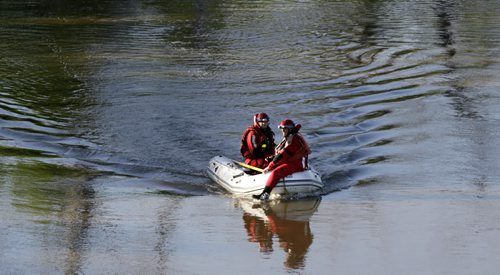 Fire Dept. water rescue members search the Red River near the Provencher Bridge Tuesday morning after a person was seen threatening to jump from a bridge over earlier. Not sure of out come. Wayne Glowacki / Winnipeg Free Press June 2 2014