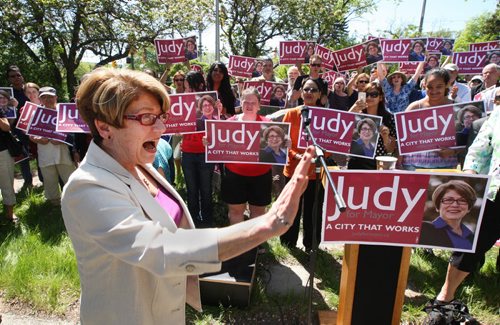 Mayoral candidate Judy Wasylycia-Leis arrives at her first kick off news conference Tuesday afternoon at the corner of Linwood St and Ness Ave in a park called Wightman Green-  See story- June 02, 2014   (JOE BRYKSA / WINNIPEG FREE PRESS)