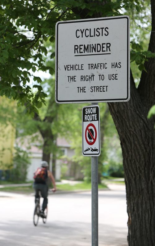 A Sunday cycling regulation sign photographed on Wolseley Avenue on Wed., June 4, 2014. Changes are coming to Sunday bike routes. Photo by Jason Halstead/Winnipeg Free Press