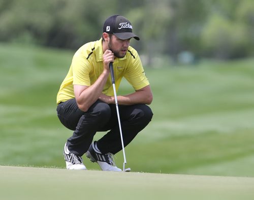 University of Manitoba Bisons golfer Bryce Barr lines up a putt at the Canadian University College Championship at Southwood on Wed., June 4, 2014. Photo by Jason Halstead/Winnipeg Free Press