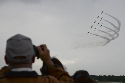 Onlookers of the show took pictures of the Snowbirds as perform at the Southport Airport in Portage la Prairie in honour of the Royal Canadian Air Force's 90th anniversary. Sarah Taylor / Winnipeg Free Press