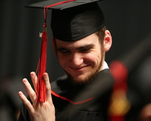 Digital Media Design graduate Aaron Corso plays with the tassel on his cap backstage before the Red River College convocation for the School of Business and Applied Arts and the School of Continuing Education on Wed., June 4, 2014, at the Centennial Concert Hall. Photo by Jason Halstead/Winnipeg Free Press