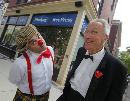 LOCAL-CAFE- KIDS FESTIVAL - Pedro Tochas and Al Simmons pose for a photo in front of the Winnipeg Free Press Cafe. BORIS MINKEVICH / WINNIPEG FREE PRESS  June 5, 2014