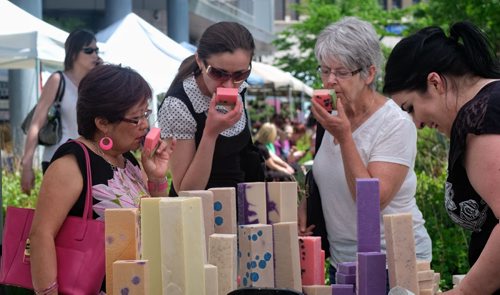 Watermelon soap seems to be popular at one of the stalls at the Downtown Winnipeg Farmers Market which opened Thursday at the Manitoba Hydro Place Plaza and will be open every Thursday 10-4 until October.   140605 June 05, 2014 Mike Deal / Winnipeg Free Press