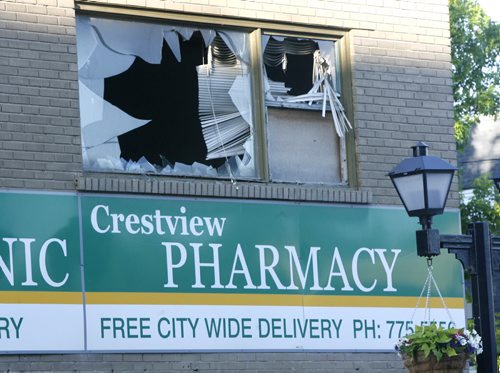 The scene of a early Friday morning fire at the Crestview Pharmacy on Ellice Ave. at Furby St. Wayne Glowacki / Winnipeg Free Press June 6 2014