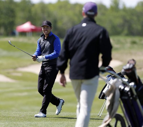 2 of 3     Western University Mustang golfer, Traynor Turkiewicz (right), apologizes to U of M Bison golfer Josh Wytinck for shanking his golf ball from the rough on #13 and accidentally hitting in Wytinck's abdomen. The ball would have gone into the water if it had not hit Wytinck. Wytinck was not in the normal line of fire. He shook off the painful shot to continue on to parr the hole at the 2014 Canadian University /College Golf Championship  at Southwood G&CC final day action  June 6 2014 / KEN GIGLIOTTI / WINNIPEG FREE PRESS
