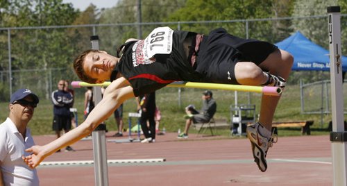 Jorden Devloo  from Prairie Mountain High School catches the bar as he  competes in the senior boys high jump final at the 2014 Milk Provincial High School Track & Field Championship at the U of M University Stadium Friday. The championship runs until June 7. Melissa Martin story    Wayne Glowacki / Winnipeg Free Press June 6 2014