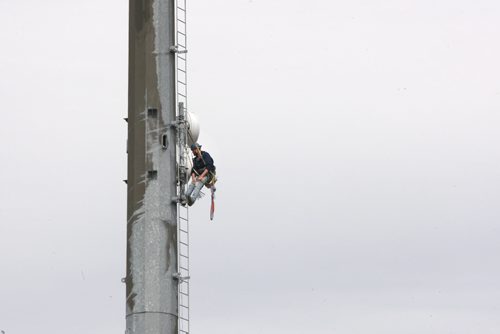 A worker takes a break while installing communication equipment on a cell phone tower on McPhillips and Jefferson Ave Friday afternoon- Standup photo- June 06, 2014   (JOE BRYKSA / WINNIPEG FREE PRESS)